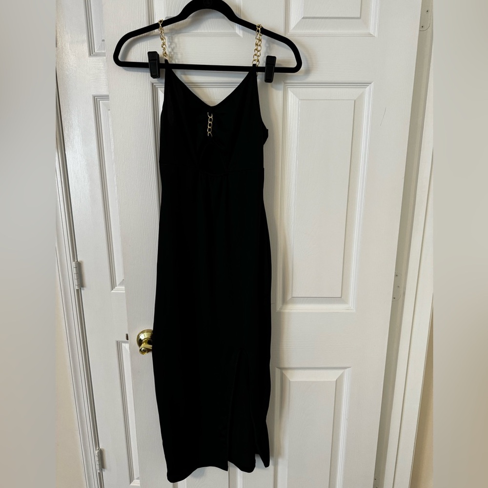 Black dress with gold chain details and slit